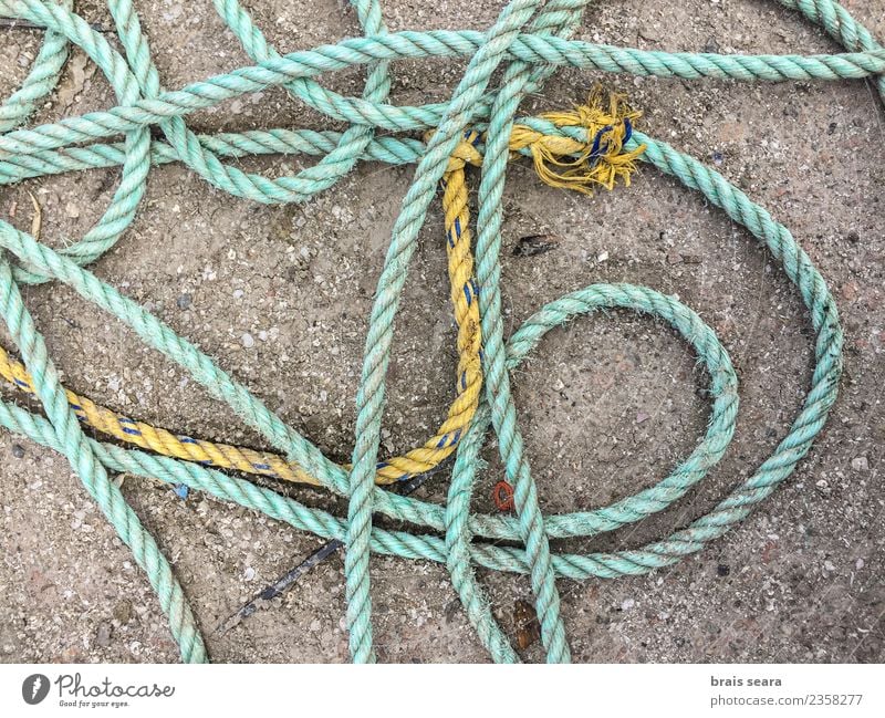 A tangle of fishing rope. Work and employment Profession Industry Logistics Rope Fishing village Harbour Navigation Boating trip Fishing boat Watercraft Stone