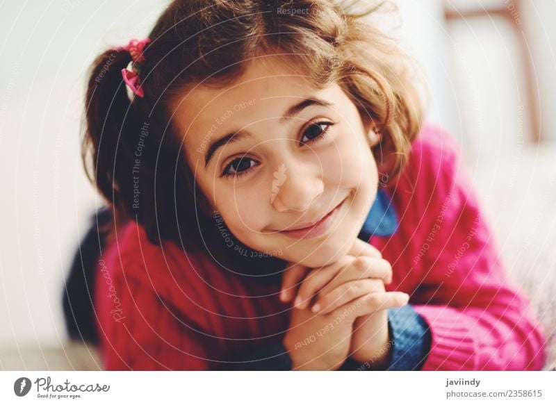 Adorable little girl with sweet smile lying down on bed. Joy Happy Beautiful Face Child Human being Girl Woman Adults Infancy 1 3 - 8 years Smiling Small Cute