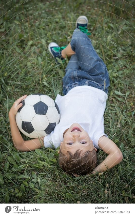 Portrait of a young boy with soccer ball. Lifestyle Joy Happy Relaxation Leisure and hobbies Playing Summer Sports Soccer Child Human being Boy (child) Man