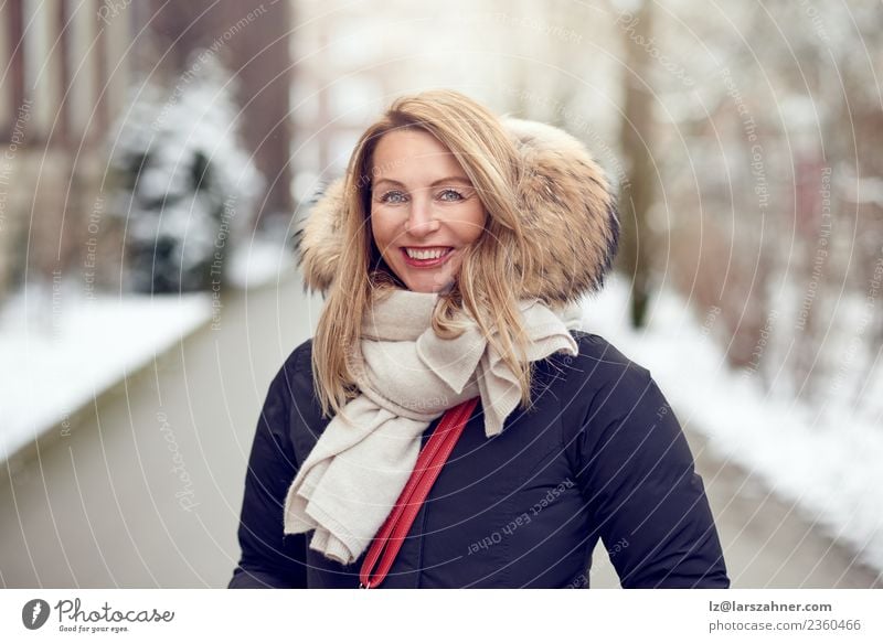 Friendly young blond woman outdoors in winter Lifestyle Happy Beautiful Face Winter Snow Woman Adults 1 Human being 45 - 60 years Park Fashion Coat Fur coat
