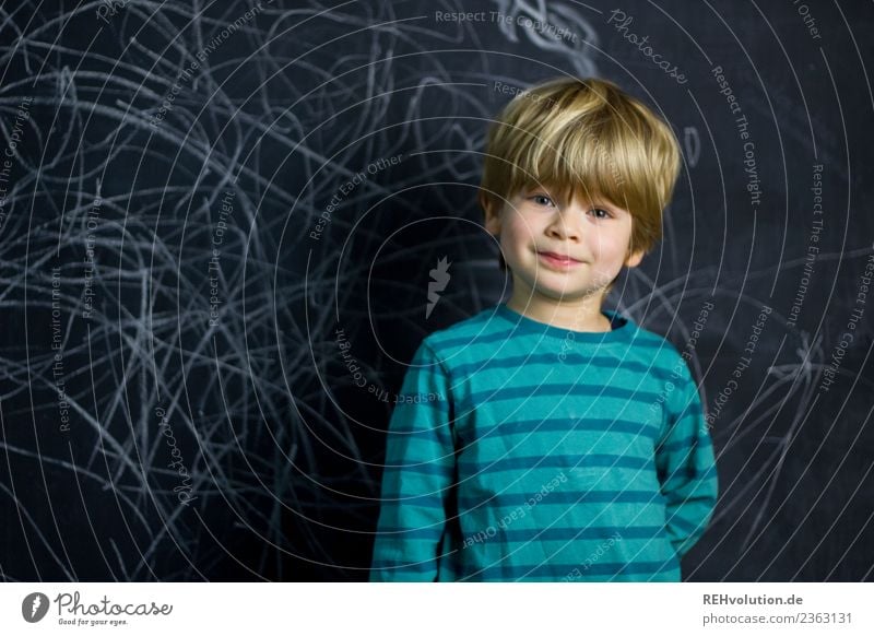 Boy stands in front of a blackboard wall Leisure and hobbies Parenting Education Kindergarten Study Schoolchild Human being Masculine Child Boy (child) 1