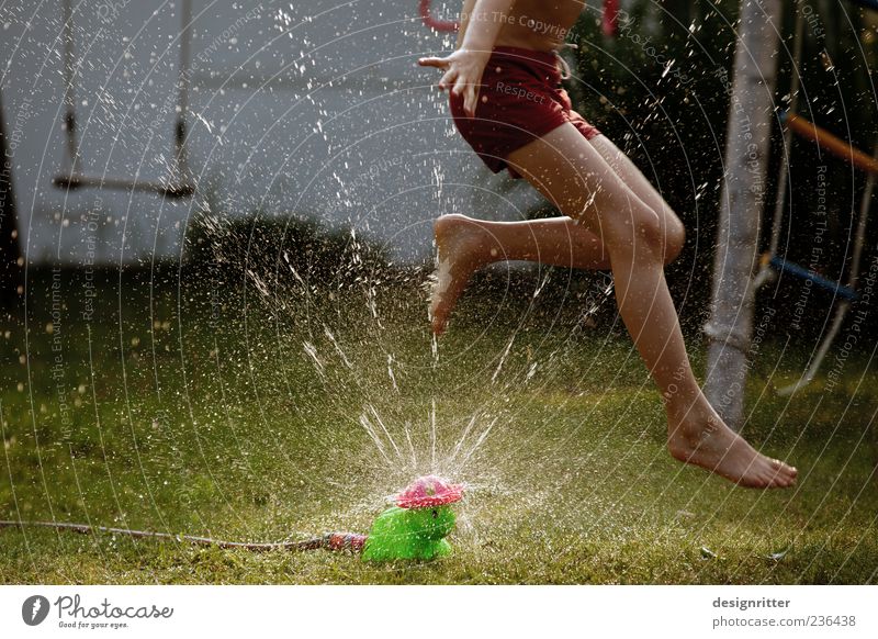 Wuaaahh! Playing Garden Child Boy (child) Infancy Legs Feet 8 - 13 years Water Drops of water Summer Beautiful weather Grass Jump Romp Wild Joy Happiness