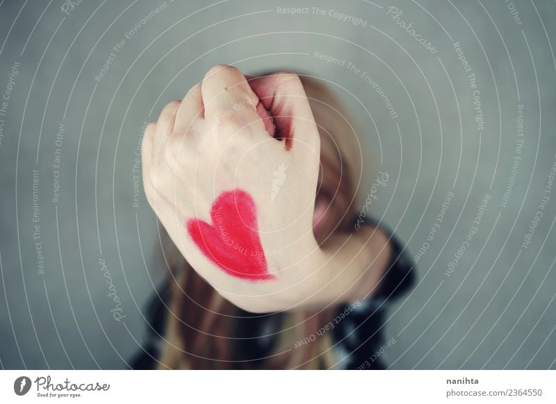 Young woman with a red heart painted in her hand Style Design Joy Healthy Health care Wellness Valentine's Day Human being Feminine Youth (Young adults) Hand 1
