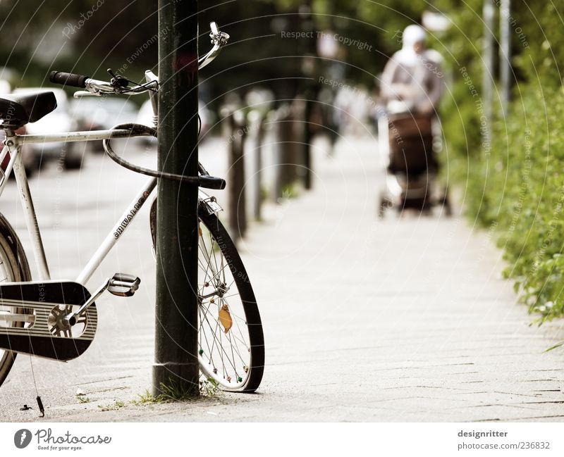The air is out in Düsseldorf Woman Adults Mother Family & Relations Duesseldorf Town Populated Means of transport Passenger traffic Pedestrian Street Bicycle