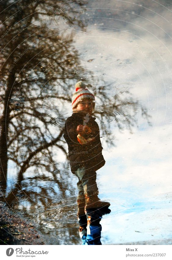 puddle Human being Child Toddler Infancy 1 1 - 3 years Water Weather Bad weather Street Lanes & trails Dirty Cold Wet Puddle Hop Muding Colour photo