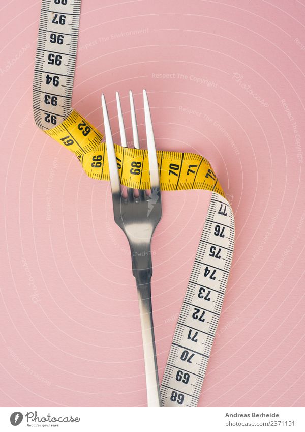 Diet, fork with tape measure Nutrition Fasting Fork Lifestyle Healthy Eating Overweight Fitness Yellow Pink Esthetic Personal hygiene cutlery dieting exercise