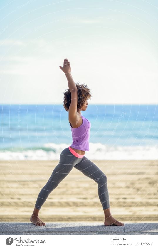 Black woman, afro hairstyle, doing yoga in the beach Lifestyle Beautiful Body Hair and hairstyles Wellness Relaxation Meditation Leisure and hobbies Beach Ocean