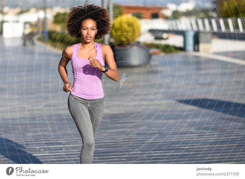 Black woman, afro hairstyle, doing yoga in the beach - a Royalty Free Stock  Photo from Photocase