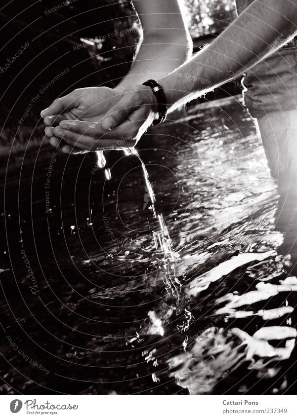 water catcher 1 Human being Water Drops of water River Touch Movement Glittering Stand Fluid Ladle Light Hand Dripping Black & white photo Exterior shot Evening