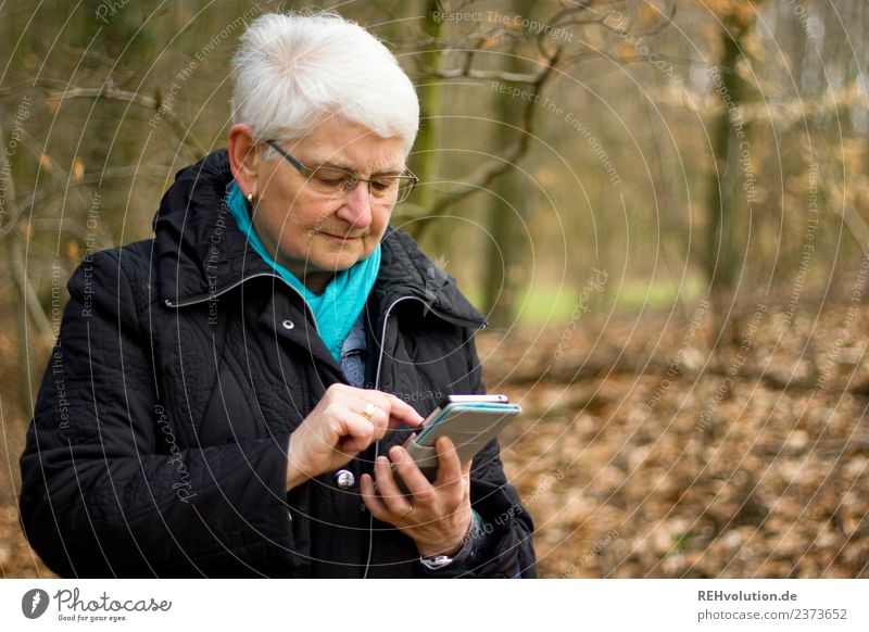 Grandma in the forest with smartphone mobile PDA Technology Telecommunications Information Technology Internet Human being Feminine Female senior Woman