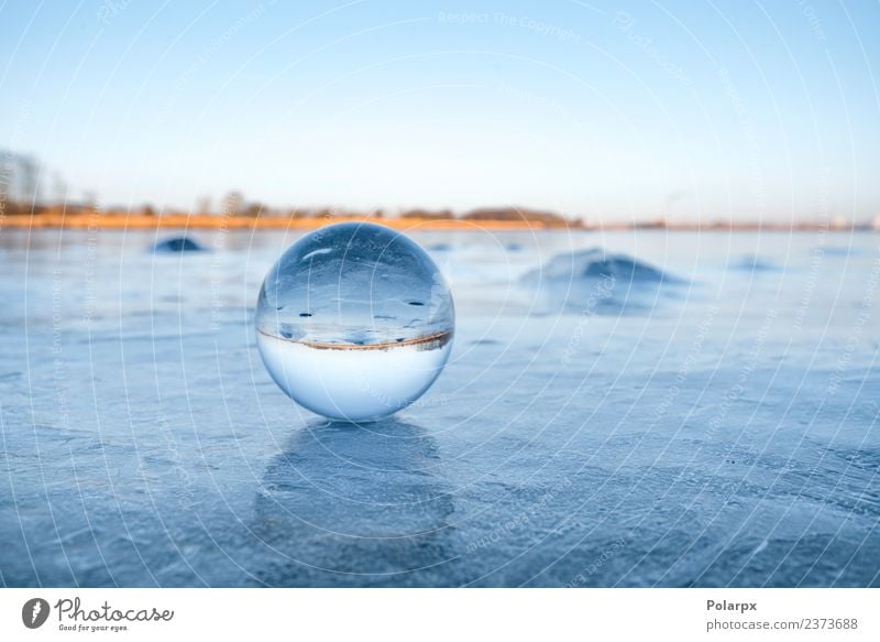 Transparent glass orb on a frozen lake Design Beautiful Wellness Meditation Winter Snow Mountain Decoration Nature Landscape Sky Tree Rock Lake Globe Glittering