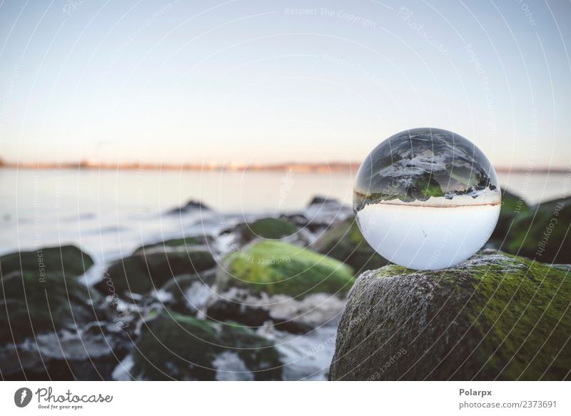 Glass orb on rocks by the sea covered Meditation Ocean Environment Nature Plant Earth Moss Rock Coast Lake River Sphere Globe Glittering Bright Clean Surrealism