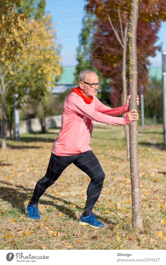 Senior Man Exercising In Park Diet Lifestyle Body Healthy Athletic Fitness Leisure and hobbies Summer Sports Jogging Human being Masculine Adults Male senior