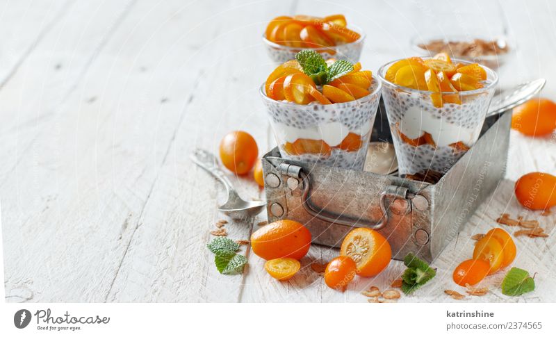 Chia pudding parfait, layered with kumquat and granola Yoghurt Fruit Dessert Eating Breakfast Diet Bowl Spoon Metal Bright Green White Colour Cereal chia