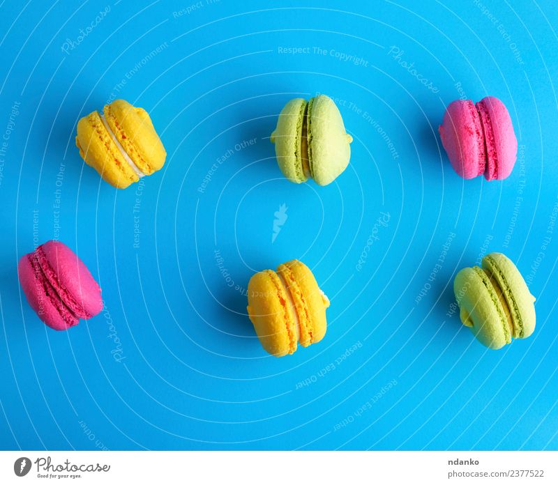 cake of almond flour with cream macarons Dessert Candy Bright Blue Yellow Green Pink Colour Macaron pastel background food colorful Vanilla french Vantage point