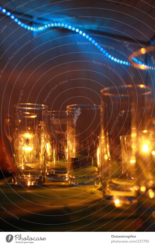 reverberation Party Glass Plastic Line Blue Brown Yellow Black Contentment Candle Candlelight Fairy lights Empty Colour photo Interior shot Copy Space bottom