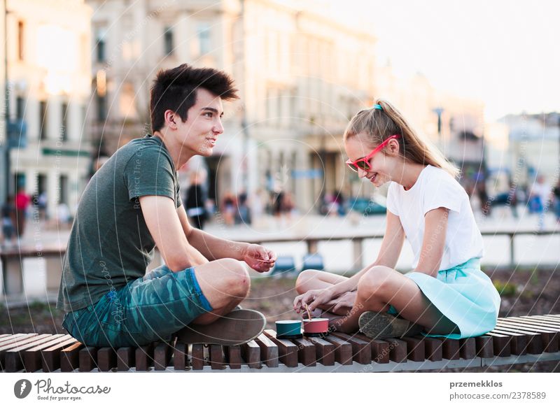 1920s Two Little Girls Sitting On Bench Eating Ice Cream Cones And