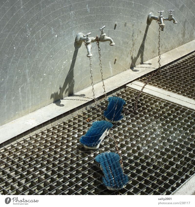 Washing day in blue Wall (barrier) Wall (building) Tap washing place Brush washing brush Grating Metal grid Chain Rust Dirty Clean Blue Cleaning Chained up