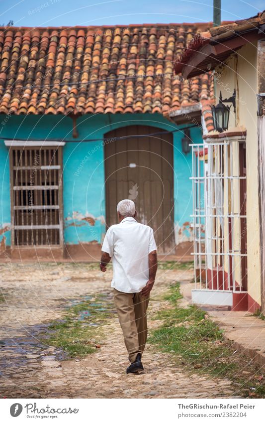 walking down the street Town Old town Blue Brown Gray Green Turquoise White Cuba Cuban Walking Trinidade Grating Human being Man Gray-haired Door Brick
