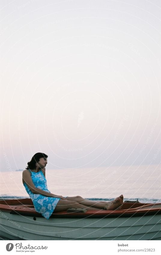 The postcard motif Horizon Watercraft Woman Dress Ocean Dream Calm Think Thought Vacation & Travel Contentment Europe Sky Blue rowboat ponder Warmth