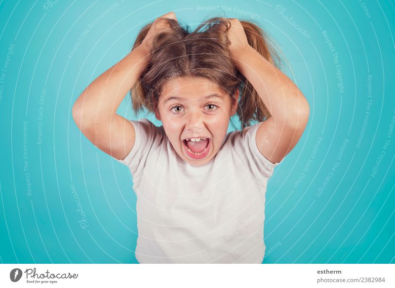 portrait of angry girl on blue background Lifestyle Human being Feminine Child Girl Infancy 1 8 - 13 years To talk To hold on Fitness Scream Aggression Creepy