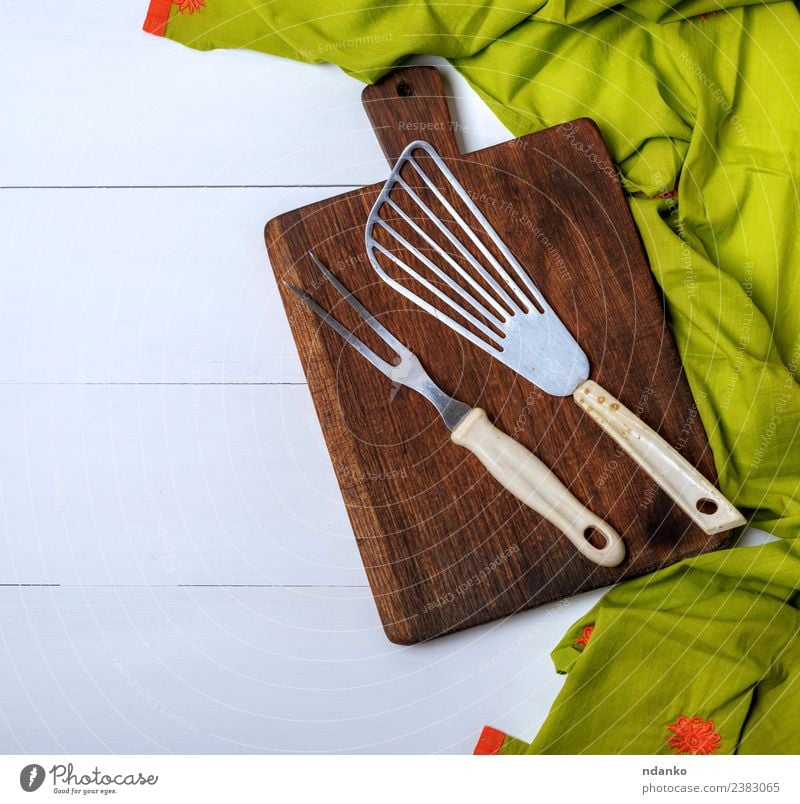 kitchen vintage fork and scapula Fork Kitchen Wood Old Dark Natural Brown Green shovel utensil board cutting background Rustic cooking food chopping Top