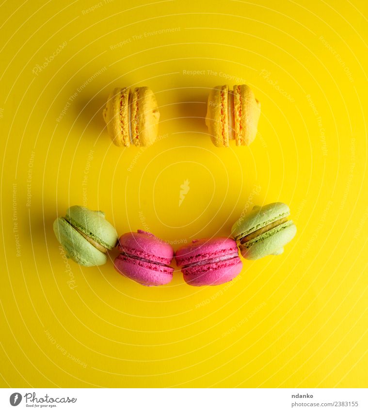 multicolored baked pastry with almond flour Dessert Candy Smiling Bright Yellow Green Pink Colour Tradition Macaron Baked goods Almond assortment background