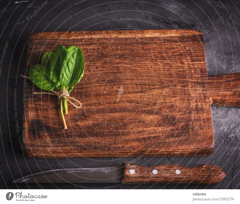 cutting board and bunch with green sorrel Herbs and spices Table Kitchen Nature Plant Leaf Wood Old Fresh Natural Above Brown Green Black background empty food