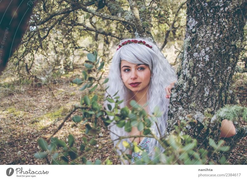 Beautiful young woman in a forest Lifestyle Style Design Exotic Hair and hairstyles Wellness Senses Calm Human being Feminine Young woman Youth (Young adults)