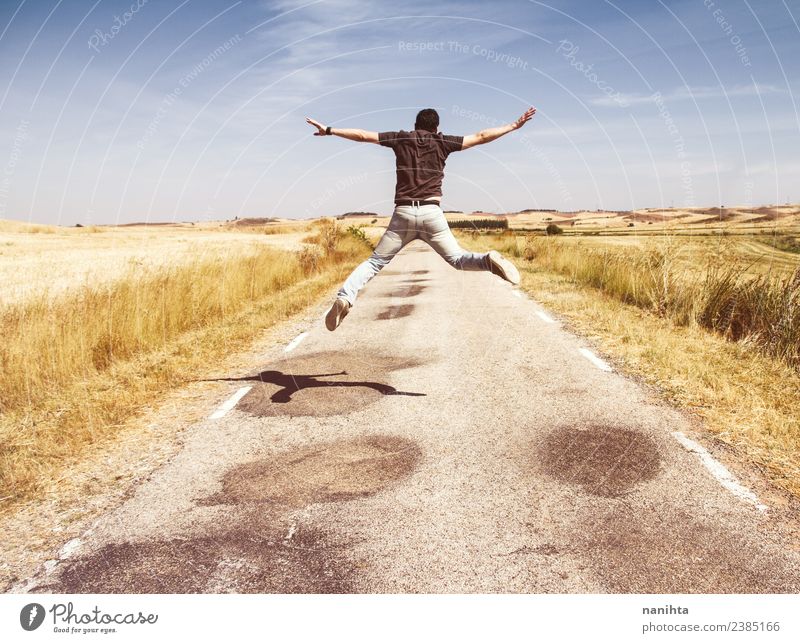 Young man jumping in a summer day Lifestyle Design Joy Happy Wellness Human being Masculine Youth (Young adults) Man Adults 1 18 - 30 years Environment Nature