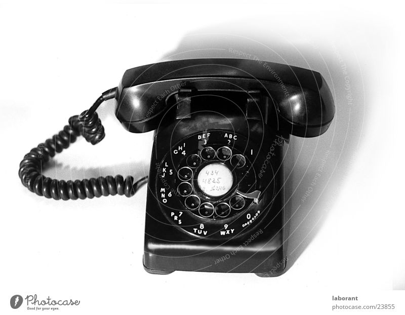 Phone Telephone Rotary dial Sixties Telecommunications Audience Cable Black & white photo sixtees bakelite