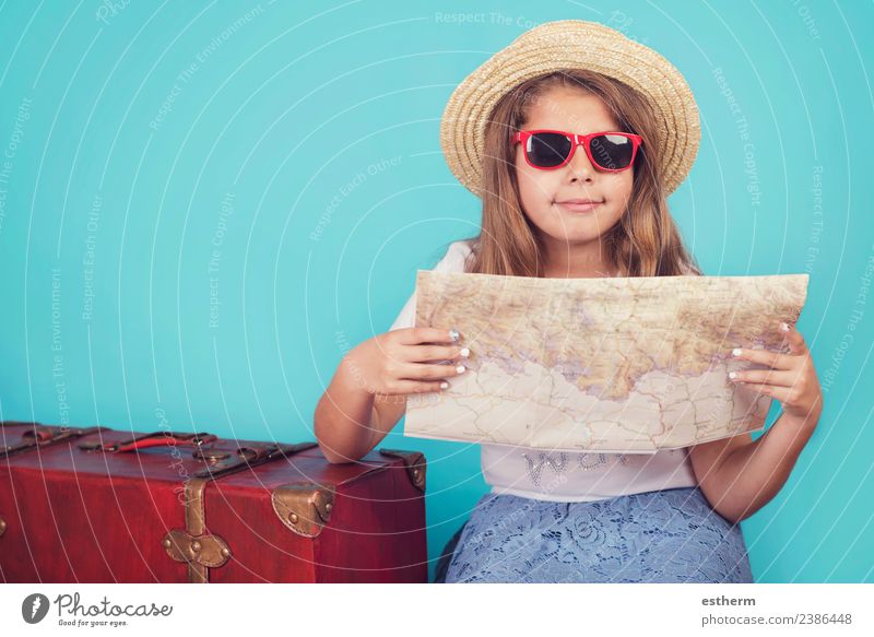 little girl with suitcase and map on blue background Lifestyle Joy Vacation & Travel Tourism Trip Adventure Freedom Summer vacation Human being Feminine Girl