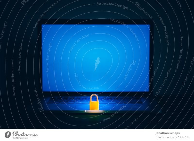 Lock on laptop as symbol for data protection & DSGVO Screen Blue Black Safety Mysterious basic data protection ordinance big data Copy Space Data protection