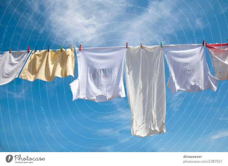 Laundry drying on the rope - a Royalty Free Stock Photo from Photocase