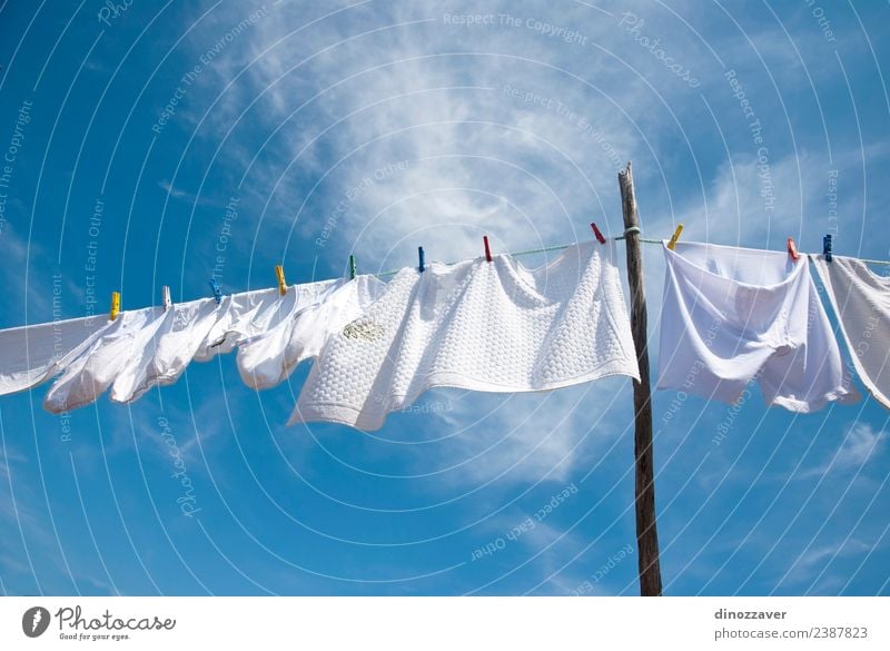 https://www.photocase.com/photos/2387823-white-laundry-drying-summer-sun-rope-sky-wind-photocase-stock-photo-large.jpeg