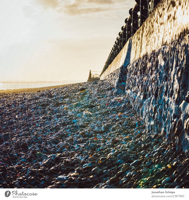 Stone beach, Brighton Beach, Brighton, England Environment Sky Sun Weather Beautiful weather Coast Esthetic Wall (barrier) Sea promenade Handrail Pebble beach