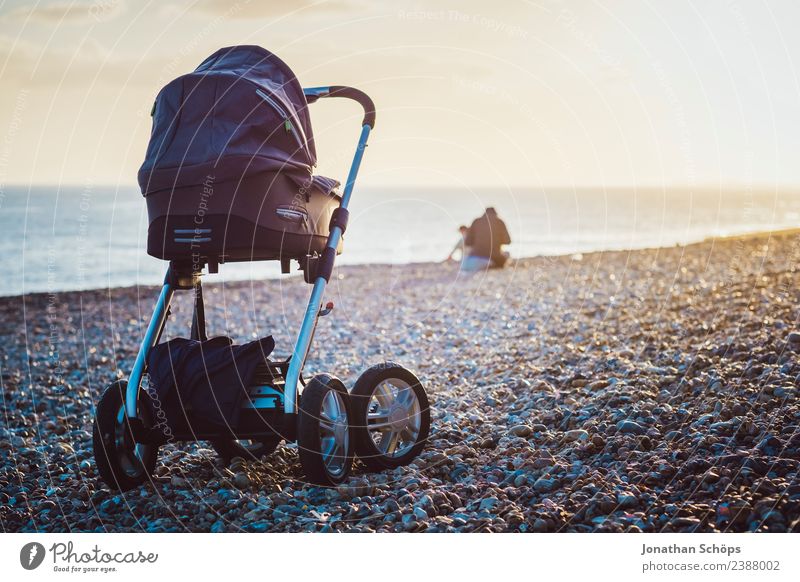 Stroller on a stone beach Landscape Esthetic Exceptional Beach Pebble beach Baby carriage Child Parenting Childhood memory Walk on the beach Ocean Cure