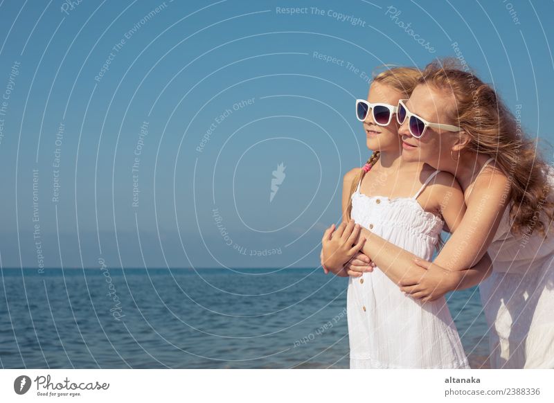 Mother and daughter standing on the beach at the day time. Lifestyle Joy Happy Relaxation Leisure and hobbies Playing Vacation & Travel Trip Freedom Camping