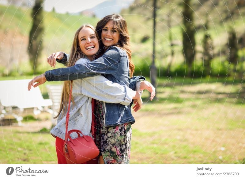 Two Happy Girls Hugging In Urban Park A Royalty Free Stock Photo From Photocase