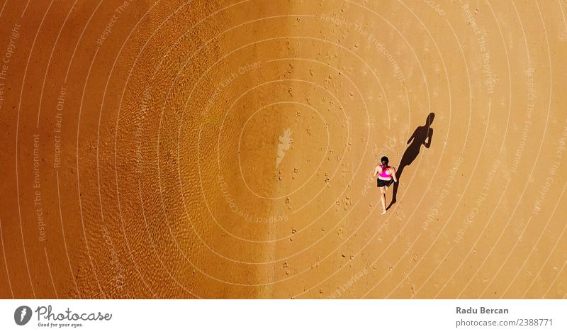 Aerial View Of Sportive Woman Running On Beach Healthy Athletic Fitness Life Adventure Summer Sun Ocean Sports Sports Training Track and Field Sportsperson
