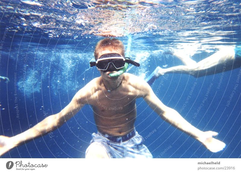 snorkeling Snorkeling Underwater photo Man Dive Maldives Shorts Upper body Ocean Diving goggles Diver Los Angeles Arm blue water Sports Blow Water wings Legs