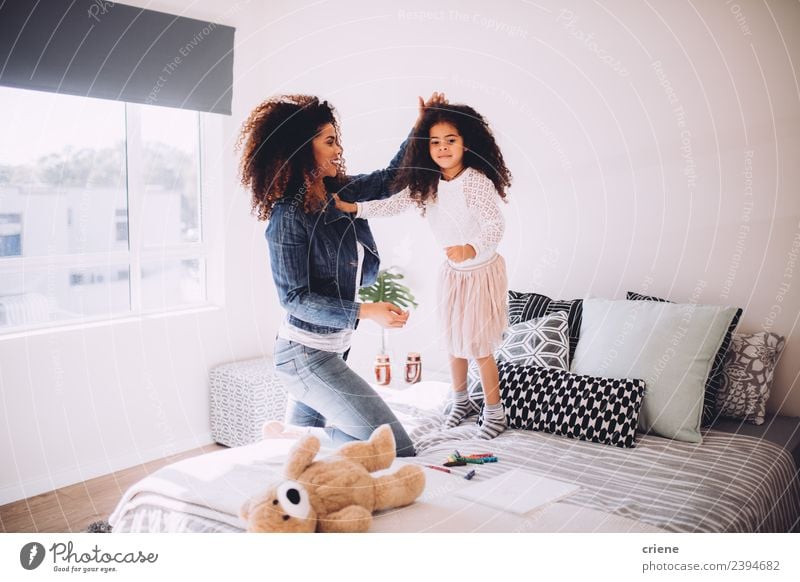 mother and daugther having fun jumping on bed Lifestyle Joy Happy Beautiful Bedroom Child Woman Adults Mother Family & Relations Infancy Smiling Love Jump
