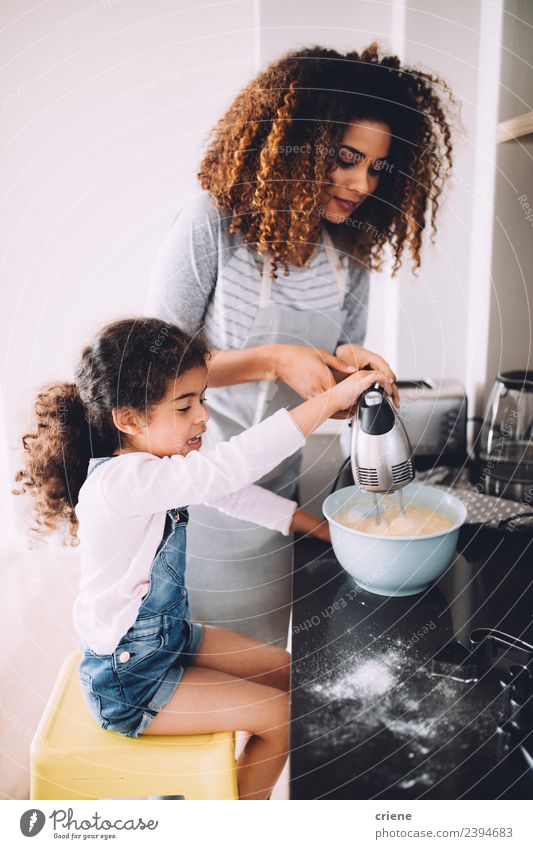 mother and daugther baking cake in the kitchen together Dessert Bowl Lifestyle Joy Happy Kitchen Child School Woman Adults Mother Family & Relations Together