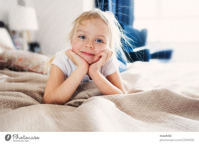 cute happy toddler girl on bed Lifestyle Joy Happy Relaxation Playing Bedroom Toddler Family & Relations Smiling Sleep Small Funny Modern Home Daughter interior