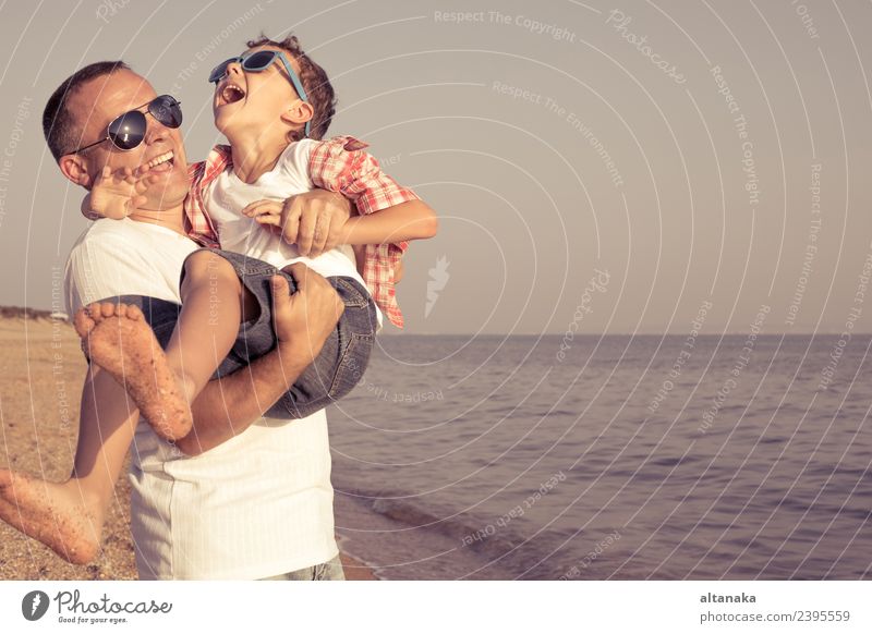 Father and son playing on the beach at the day time. Lifestyle Joy Happy Relaxation Leisure and hobbies Playing Vacation & Travel Trip Adventure Freedom Camping