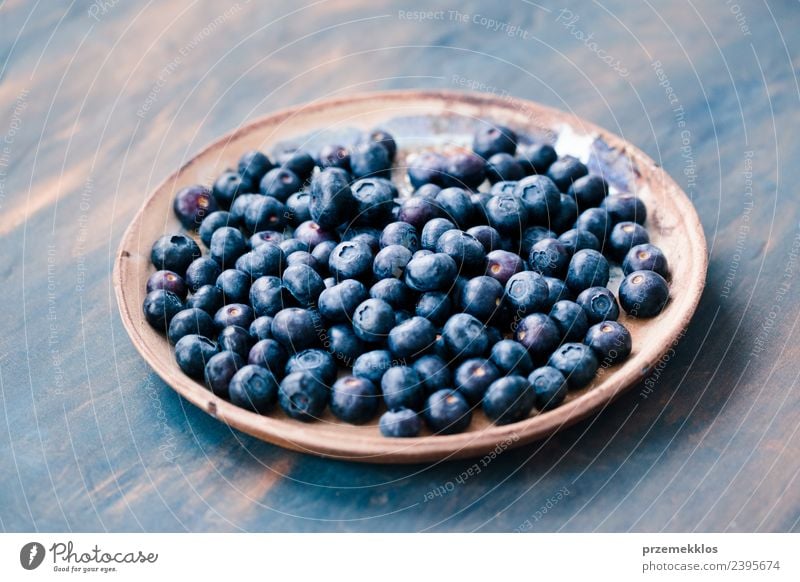 Freshly gathered blueberries put on old ceramic plate Fruit Nutrition Organic produce Vegetarian diet Bowl Summer Table Nature Wood Delicious Natural Juicy Blue