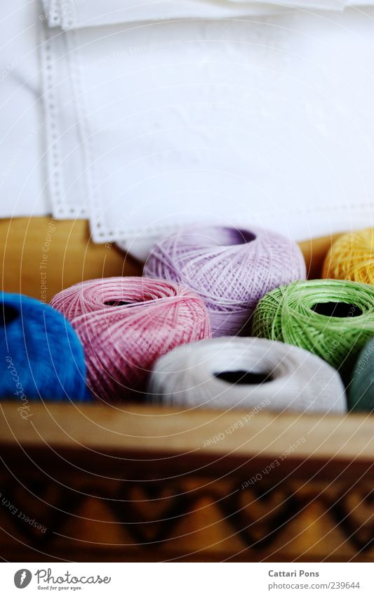 Grandma's colourful secret weapon Handcrafts Knit Lie Near Wooden box Sewing thread Multicoloured Rag Pattern Colour photo Interior shot Day Cloth