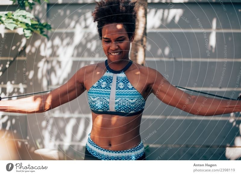 Young Melanesian woman doing exercise - a Royalty Free Stock Photo from  Photocase