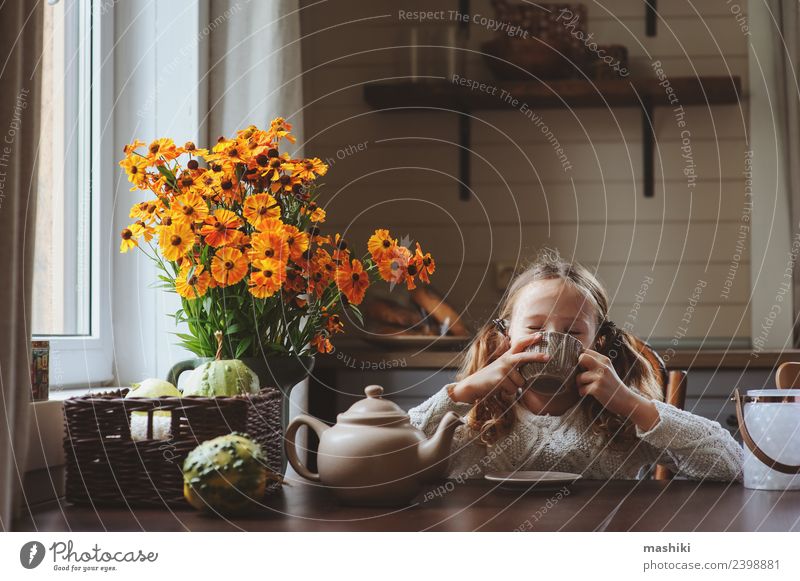 child girl having breakfast at home Breakfast Tea Lifestyle Happy House (Residential Structure) Decoration Chair Table Kitchen Child Family & Relations Autumn