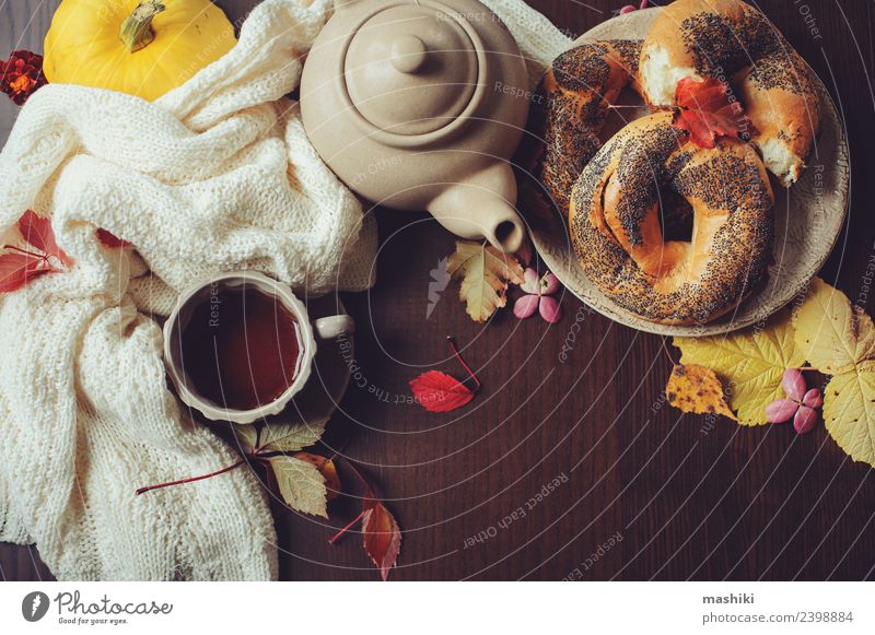 top view of cozy autumn breakfast on table Breakfast Beverage Tea Pot Lifestyle Decoration Table Autumn Leaf Sweater Safety (feeling of) Comfortable fall Bagel